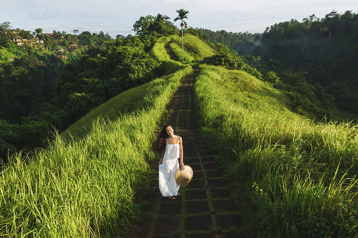 a tourist standing in the middle of Campuhan Ridge Walk in Ubud Bali