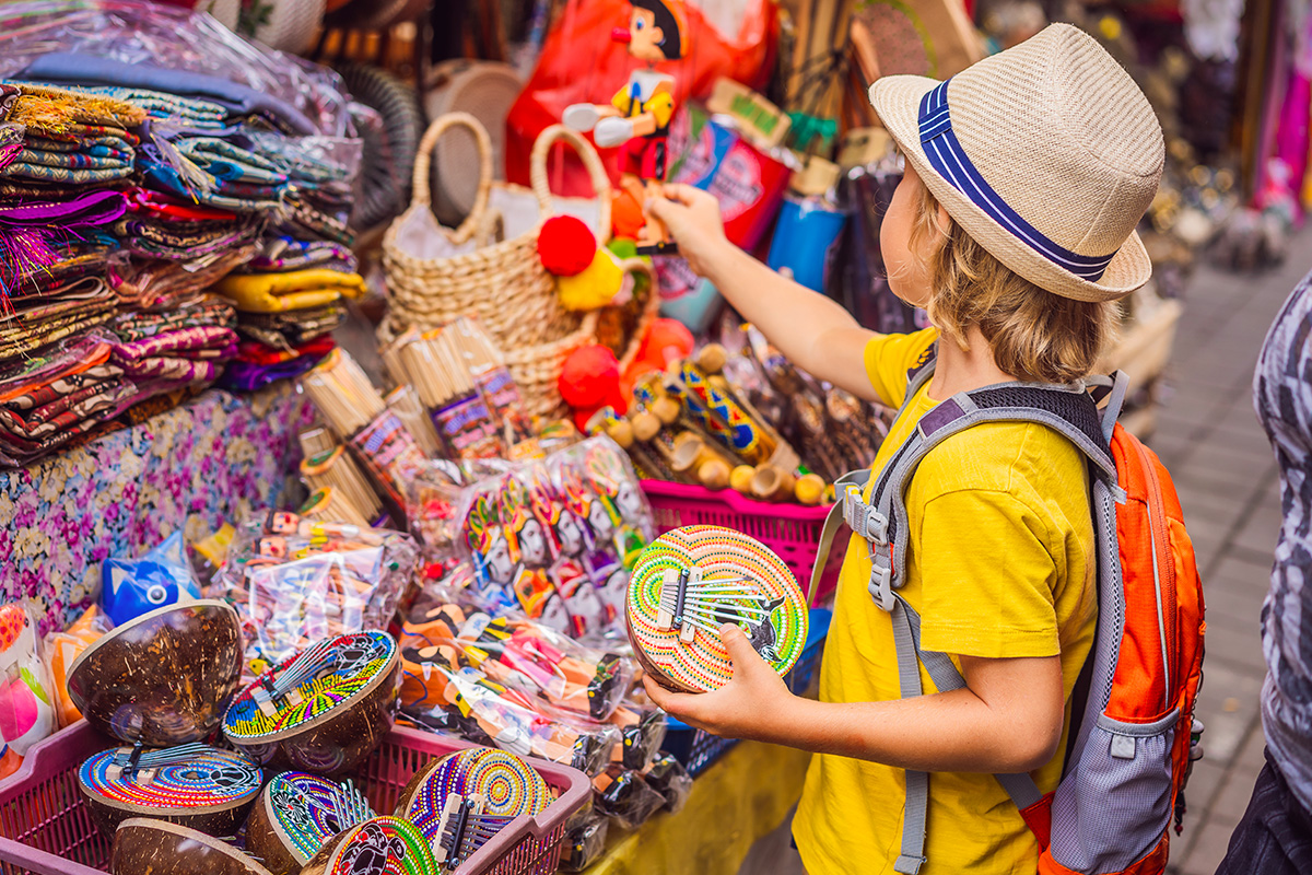 A boy buying Balinese knicks-knacks in the market