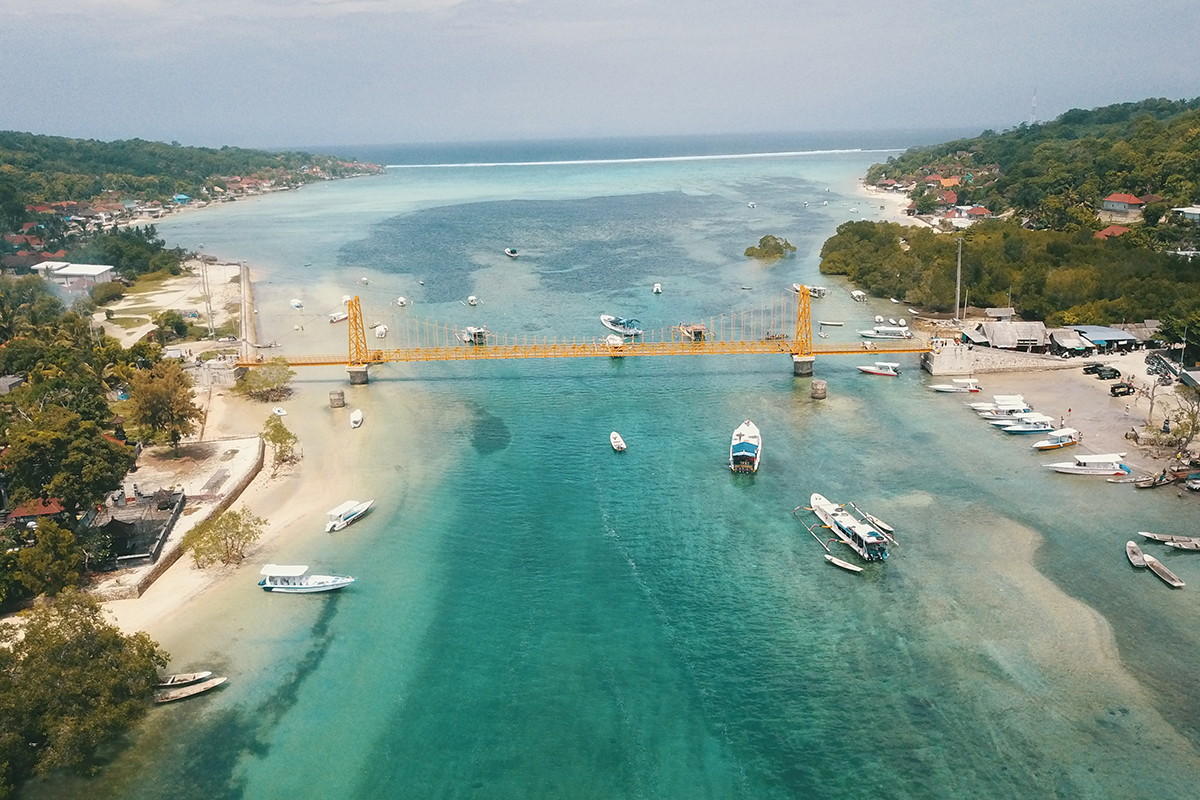 an overhead look at the yellow bridge connecting Nusa Lembongan and Nusa Ceningan