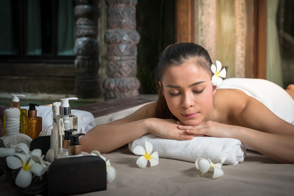 Woman laying and relaxing for Balinese spa treatment