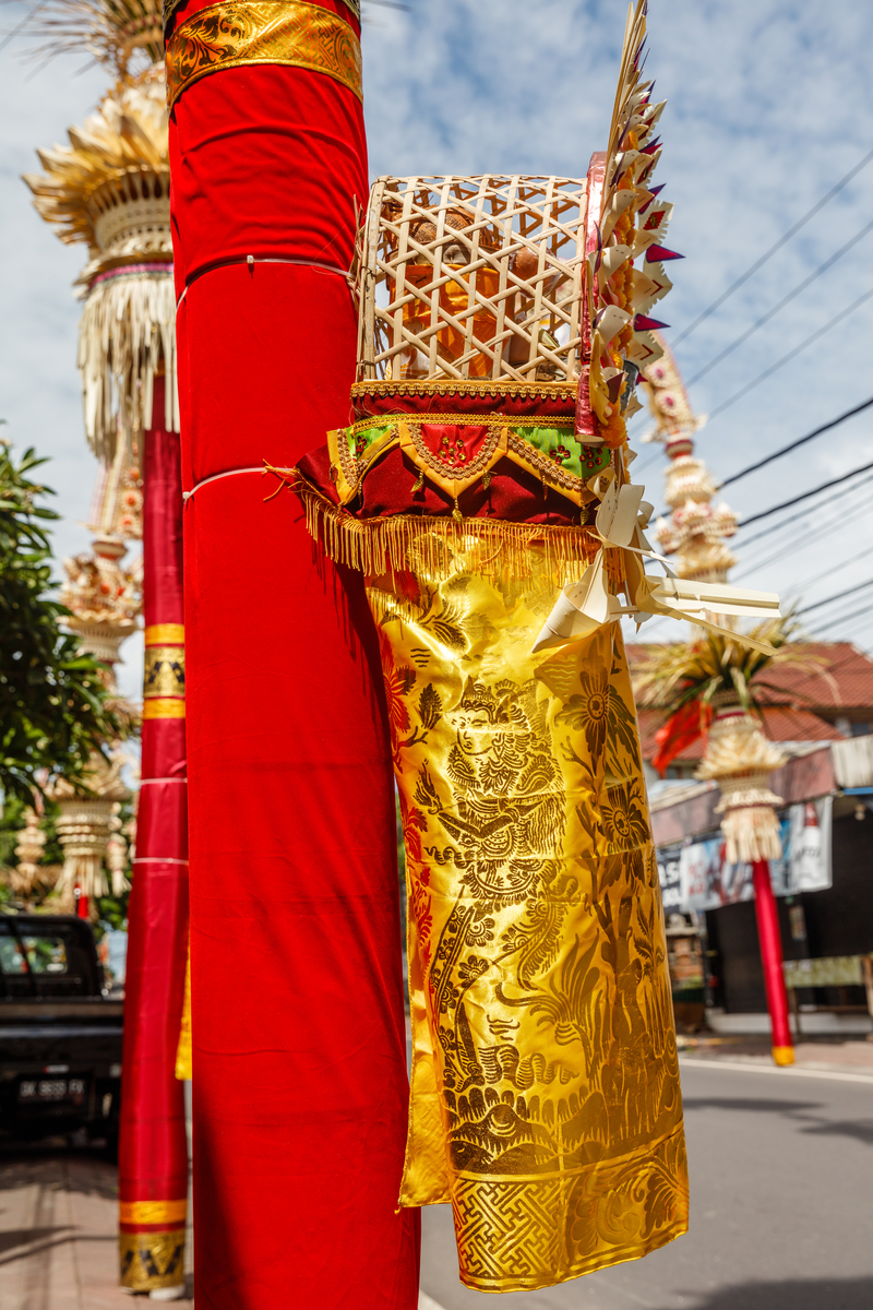 penjor poles decorated with gold prada textile in Bali