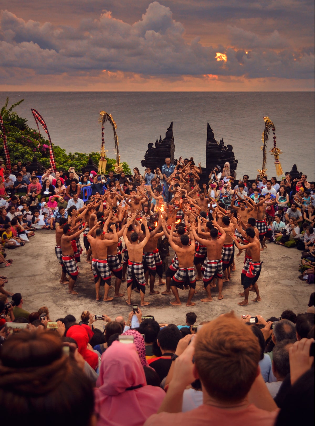 a group of men dancing Kecak Dance in Uluwatu Bali