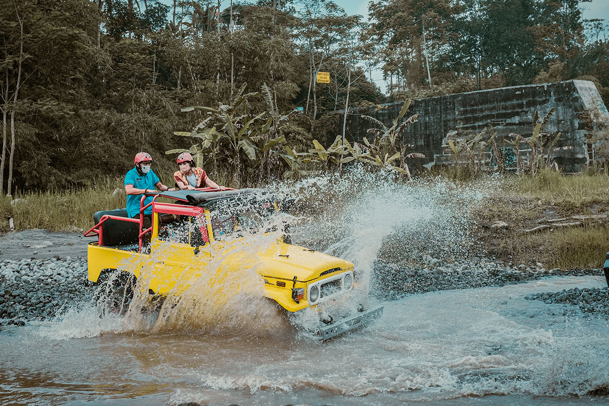 two people on an outdoor jeep adventure in Pentingsari Yogyakarta