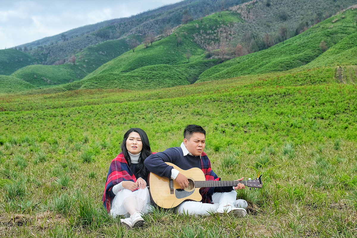 camping on the meadow surrounded by mountain