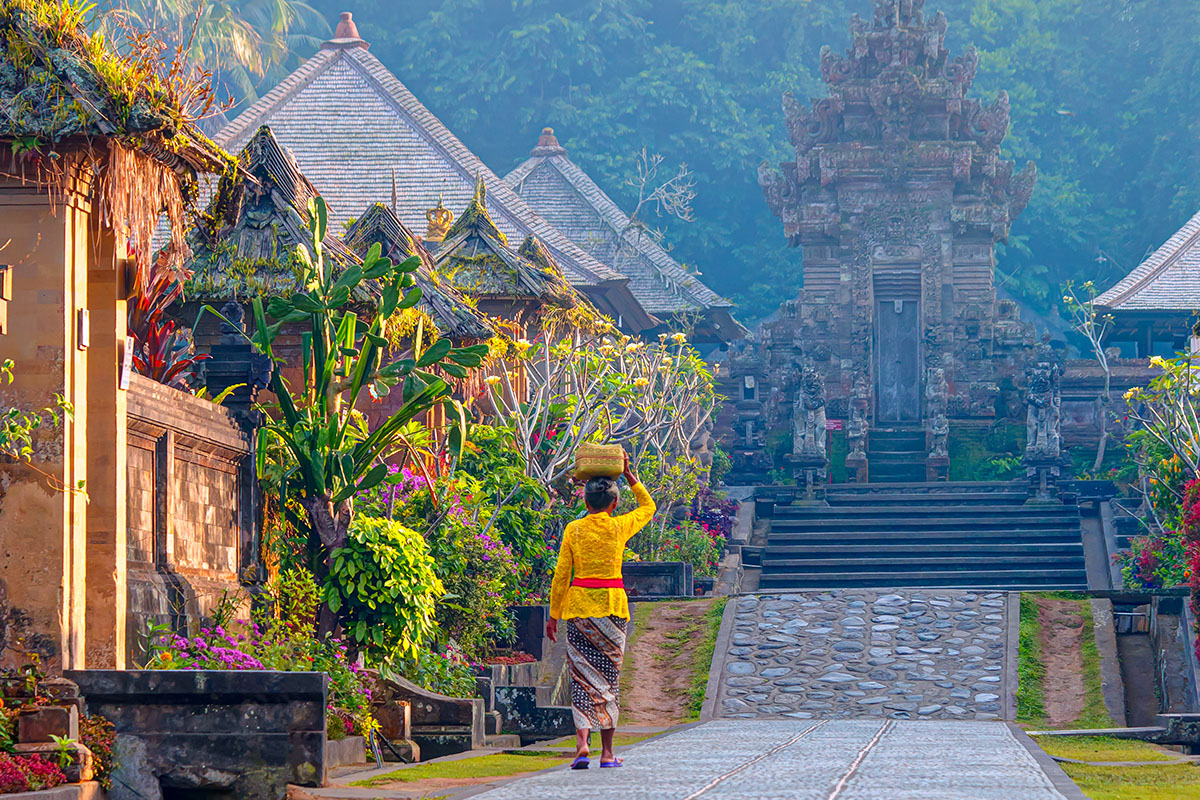 a local woman walking in Penglipuran village