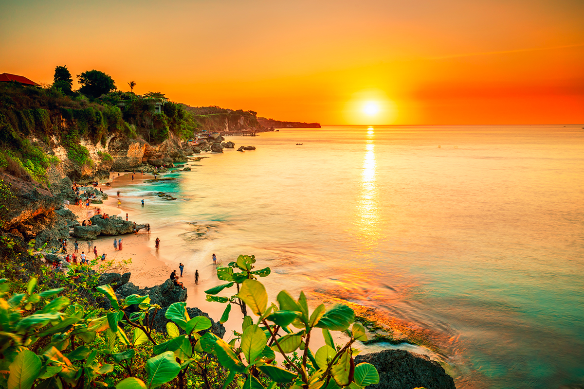 orange-red sunset at the sea of Tegal Wangi Beach