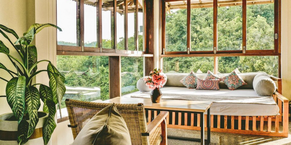 A room with a couch and a table Description automatically generated